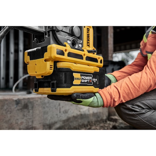 Powershift 554WH battery being attached to Powershift Diamond Drill Stand DCPS151