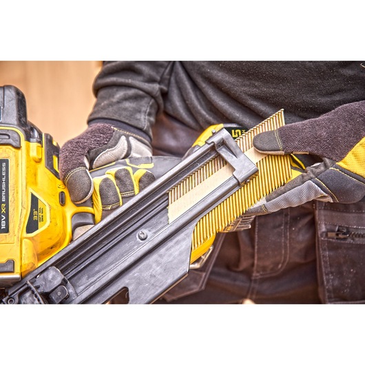 Nail magazine being loaded into a DCN930 18V XR Brushless framing nailer