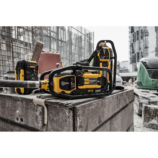 x2 Powershift Powerpack Concrete Vibrators and x1 Powershift battery DCBPS0554 on a construction site