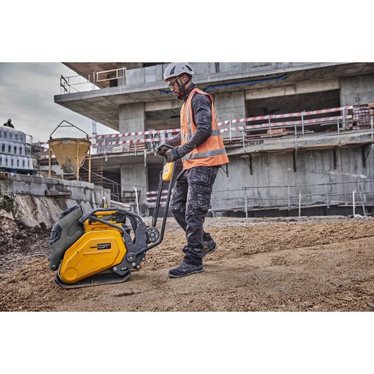 Worker uses Powershift Plate Compactor to compact the ground on a construction site