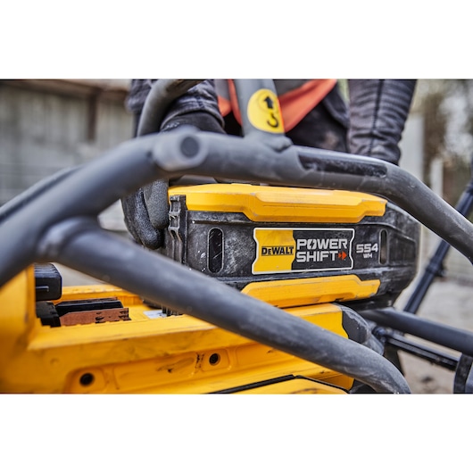 Close view of Powershift battery DCBPS0554 being attached to Powershift Plate Compactor