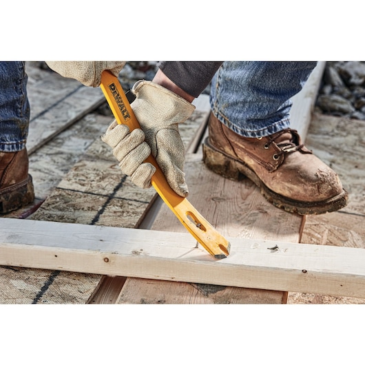 15 inch Spring Steel Flat Bar pulling nail from wood.